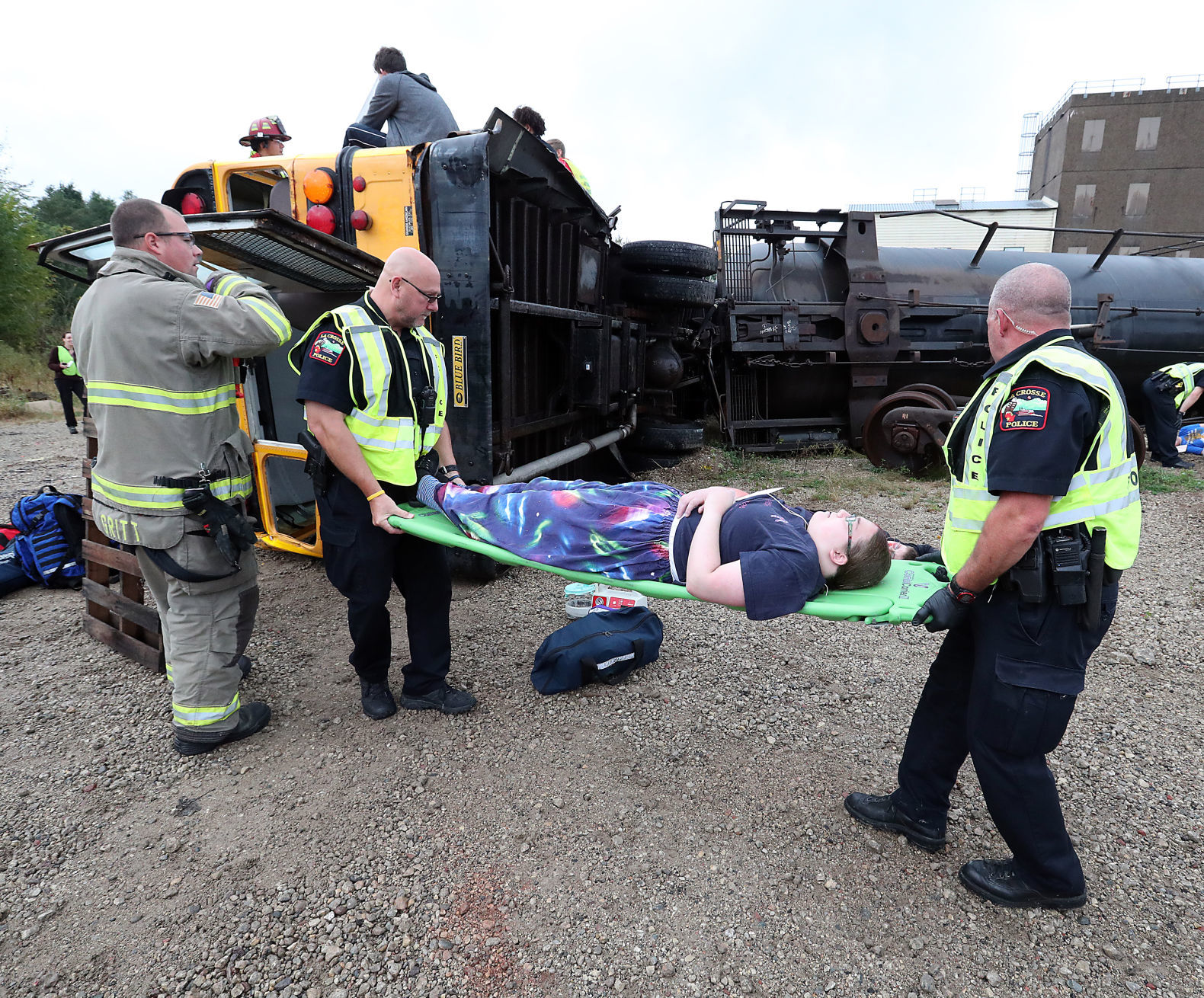 Police, firefighters aid students in bus-train crash drill